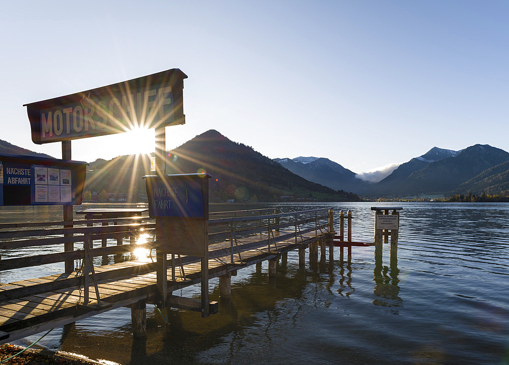 Sunrise at lake and village Schliersee in the bavarian Alps during autumn. Europe, Central Europe, Bavaria, Germany