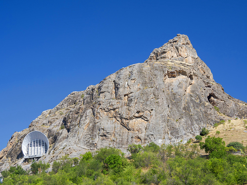 Historic and Cultural Museum, built into a cave. Mount Suleiman-Too (Sulaimain-Too, Sulayman-Too), a UNESCO World Heritage site. City Osh in the Fergana Valley close to the border to Uzbekistan. Asia, central Asia, Kyrgyzstan