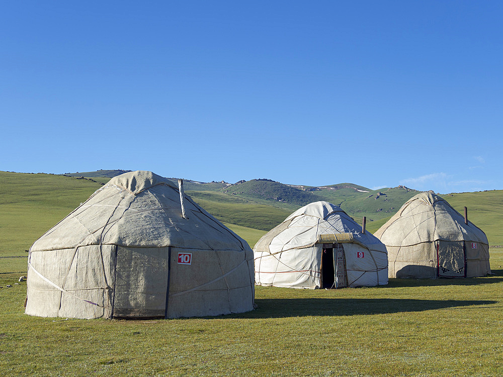 Yurts for tourists at lake Song Kol (Son Kul, Songkoel, Song-Koel). Tien Shan mountains or heavenly mountains in Kirghizia. Asia, central Asia, Kyrgyzstan