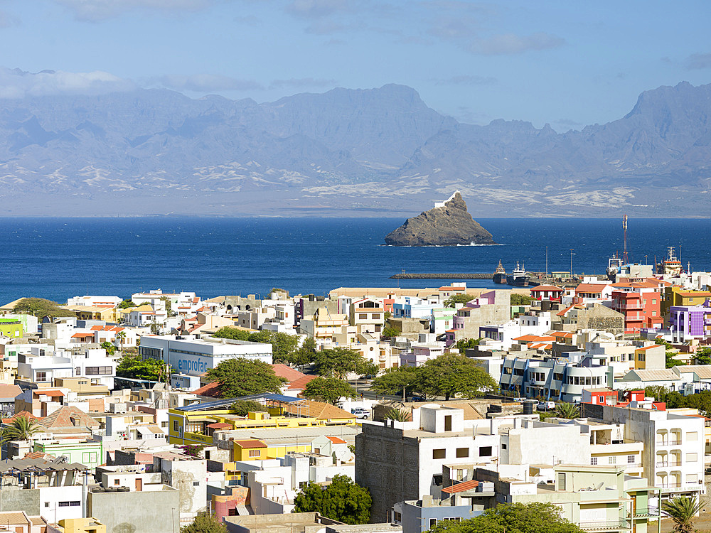 Cityview and view over the harbor towards Ilheu dos Passaros (bird island) and Santo Antao. City Mindelo, a seaport on the island Sao Vicente, Cape Verde in the equatorial atlantic. Africa, April