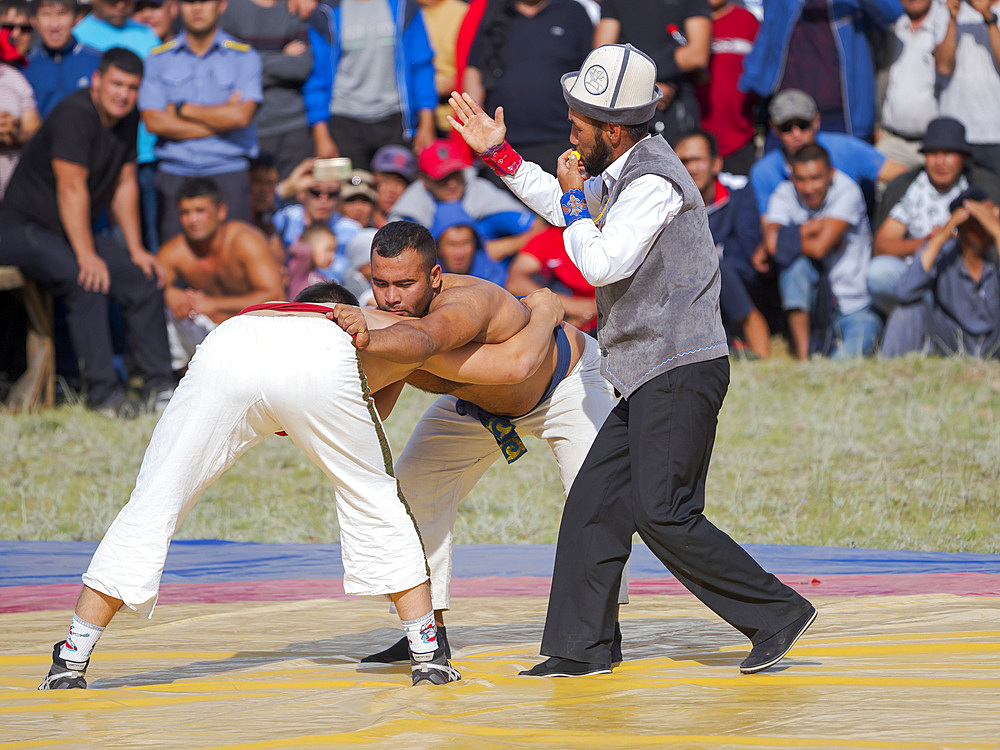 Kuresh, traditional Kyrgyz wrestling. Folk and Sport festival on the Suusamyr plain commemorating Mr Koshomkul, a sportsman and folk hero of the last century. Asia, central Asia, Kyrgyzstan