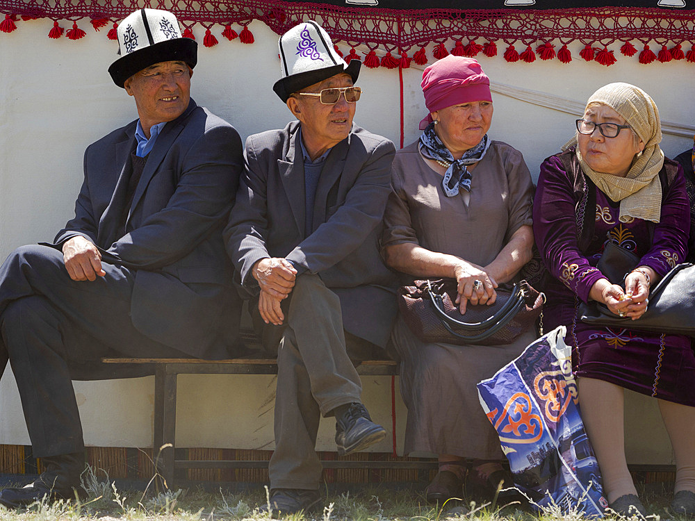 Spectator. Folk and Sport festival on the Suusamyr plain commemorating Mr Koshomkul, a sportsman and folk hero of the last century. Asia, central asia, Kyrgyzstan