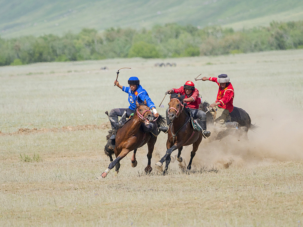 Kok Boru (Buzkashi), traditional equestrian team sport. Festival on the Suusamyr plain commemorating Mr Koshkomul, a sportsman and folk hero of the last century. Kok Boru is listed as UNESCO Intangible Cultural Heritage Asia, central asia, Kyrgyzstan