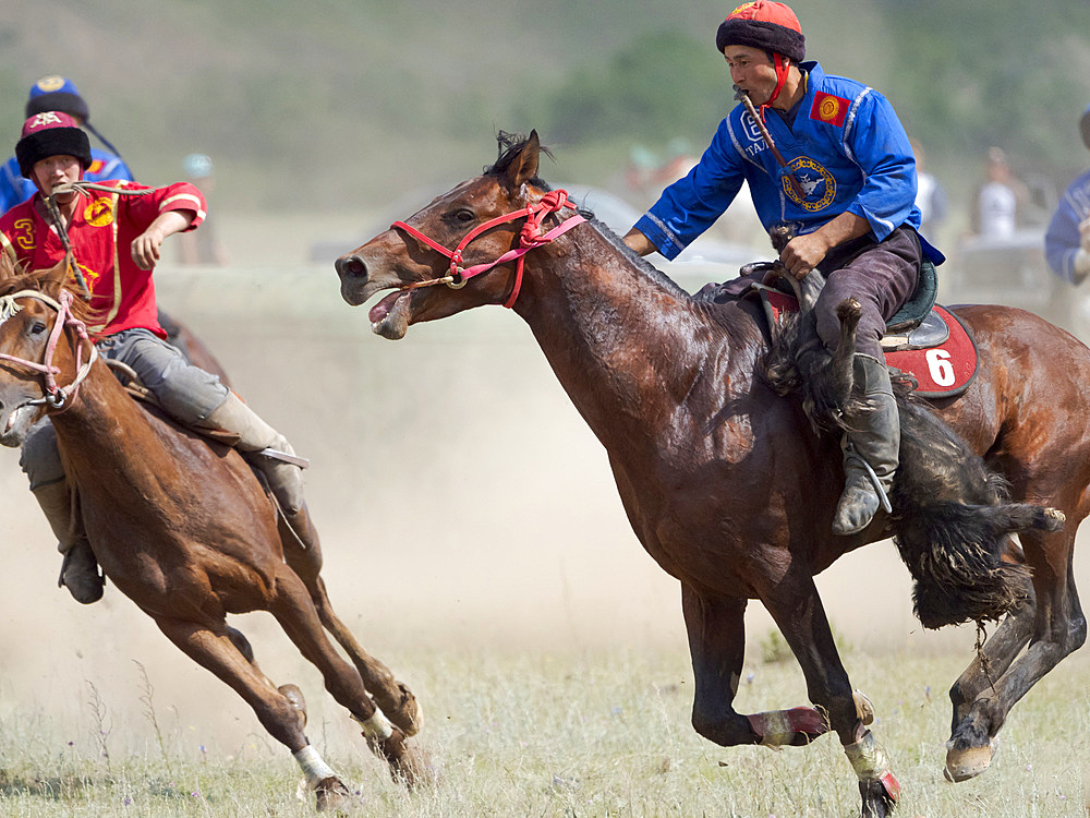 Kok Boru (Buzkashi), traditional equestrian team sport. Festival on the Suusamyr plain commemorating Mr Koshkomul, a sportsman and folk hero of the last century. Kok Boru is listed as UNESCO Intangible Cultural Heritage Asia, central asia, Kyrgyzstan