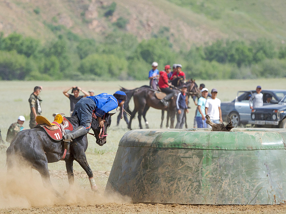 The goat is thrown into tai kazan (goal). Kok Boru (Buzkashi), traditional equestrian team sport. Festival on the Suusamyr plain commemorating Mr Koshkomul, a sportsman and folk hero of the last century. Kok Boru is listed as UNESCO Intangible Cultural Heritage Asia, central asia, Kyrgyzstan