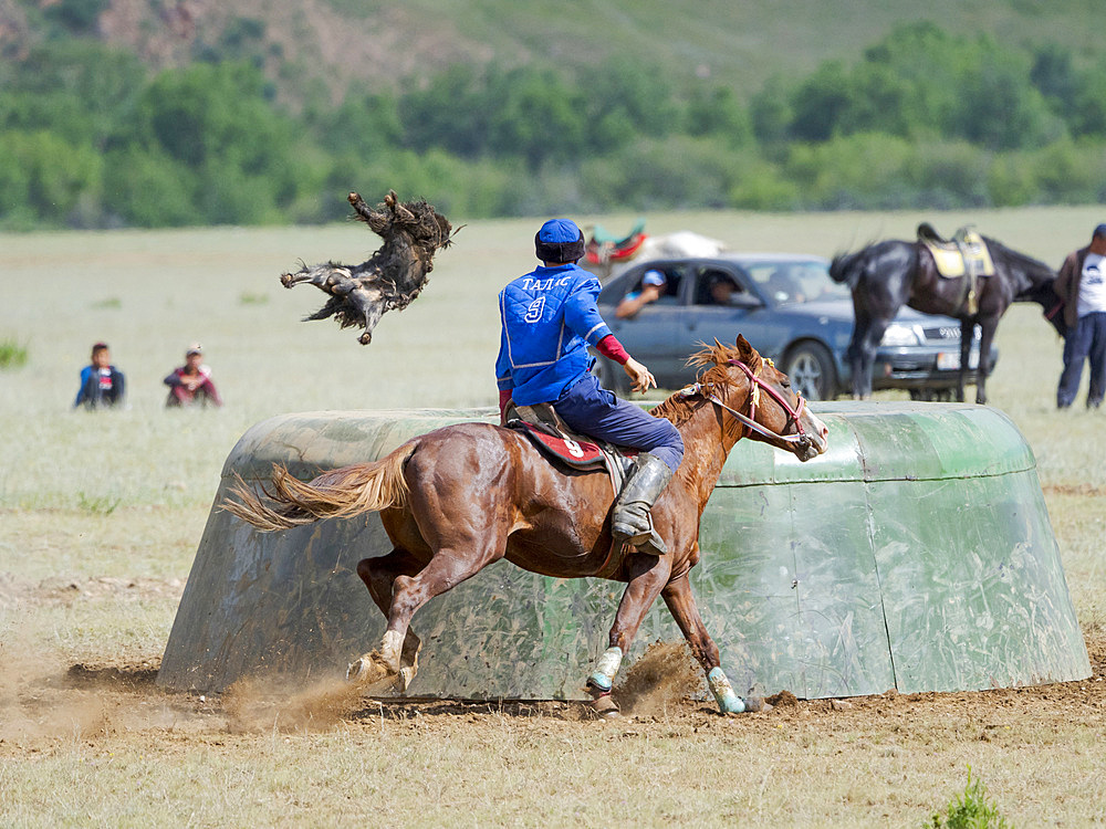 The goat is thrown into tai kazan (goal). Kok Boru (Buzkashi), traditional equestrian team sport. Festival on the Suusamyr plain commemorating Mr Koshkomul, a sportsman and folk hero of the last century. Kok Boru is listed as UNESCO Intangible Cultural Heritage Asia, central asia, Kyrgyzstan