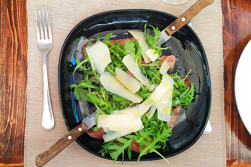 Beef carpaccio with rocket and parmesan flakes, Italy, Europe