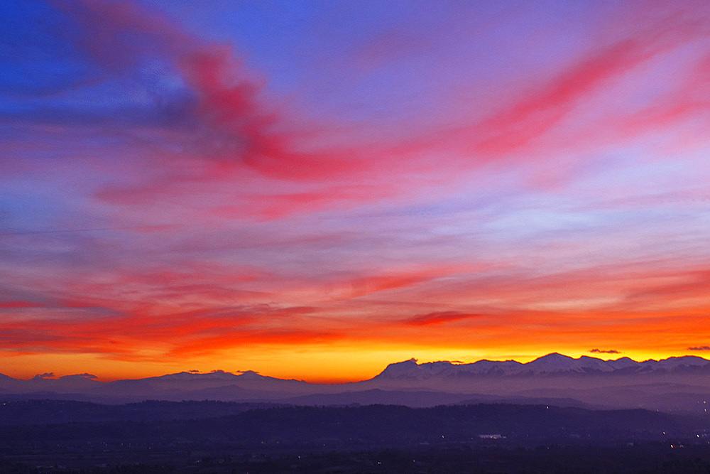 Sunset on the Sibillini Mountains seen from Macerata, Marche, Italy, Europe