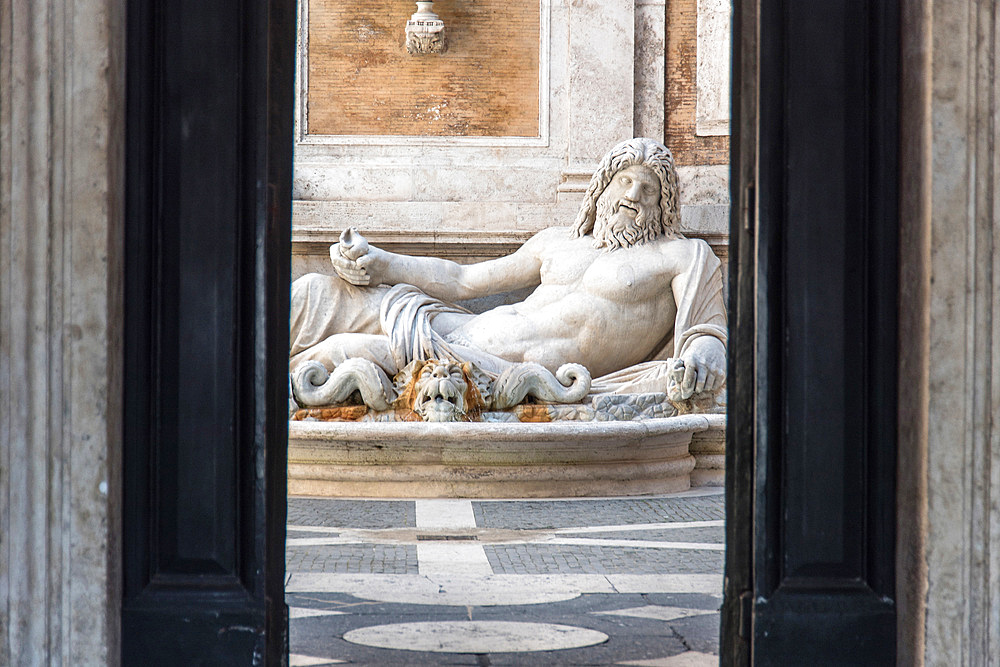 The statue of Marforio, in the courtyard of the Palazzo Nuovo, Piazza del Campidoglio on Capitoline Hill, Turist, Rome, Lazio, Italy, Europe