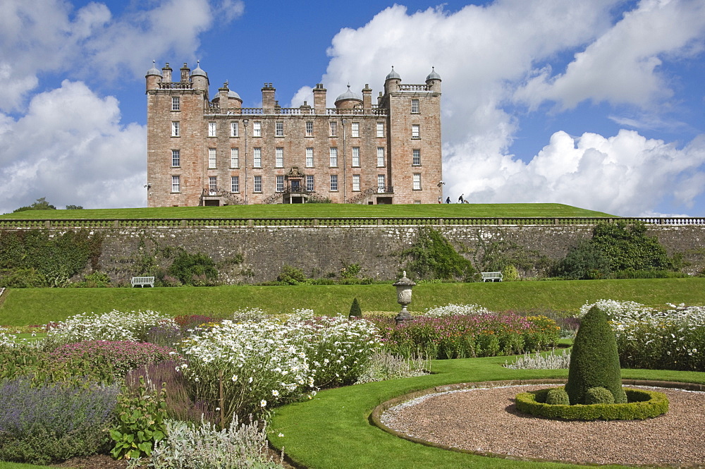 The 17th century Renaissance Drumlanrig Castle (Pink Palace) built by the 1st Duke of Queensberry, William Douglass, from the lower garden terrace, Dumfries and Galloway, Scotland, United Kingdom, Europe