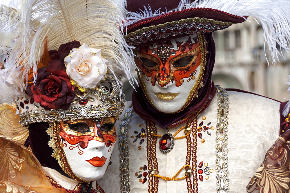 Lady and gentleman in red and white masks, Venice Carnival, Venice, Veneto, Italy, Europe