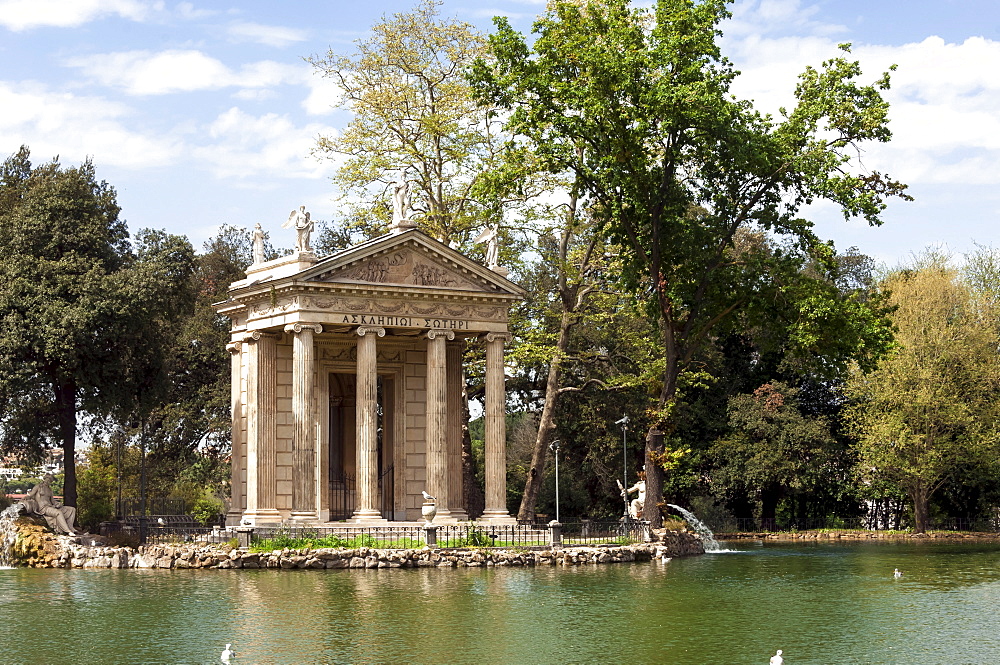 Ionic Temple of Aesculapius, God of Healing, designed by Antonio Asprucci, by an artificial lake in the Borghese Park, Rome, Lazio, Italy, Europe