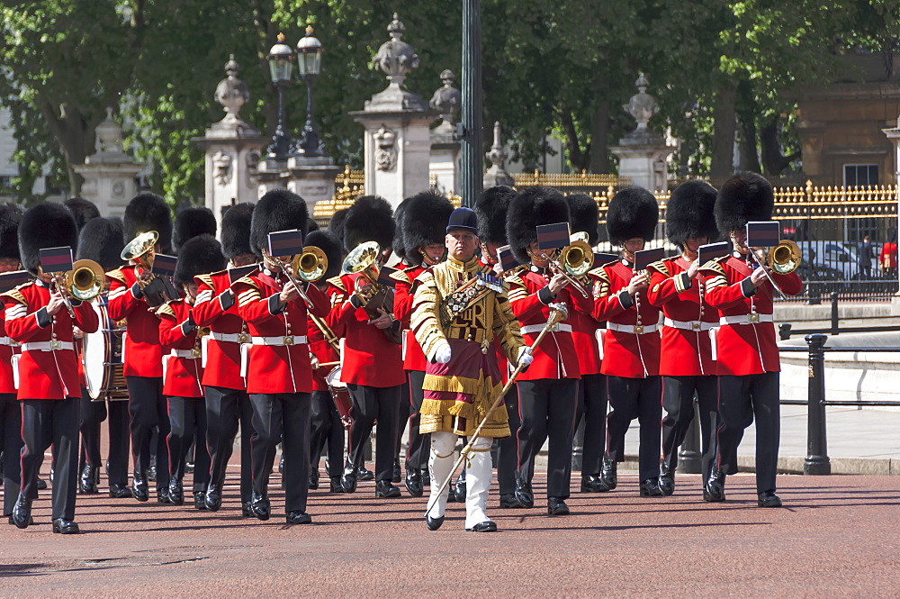 Guards Military Band marching past Buckingham Palace en route to the Trooping of the Colour, London, England, United Kingdom, Europe