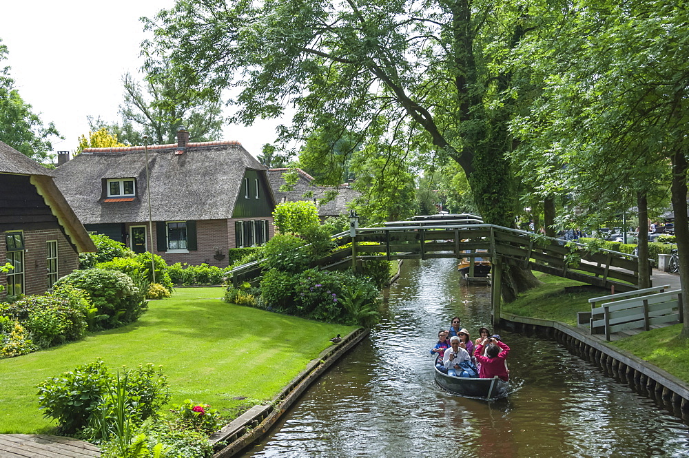 Tourists on the canal at Giethorn, Holland, Europe