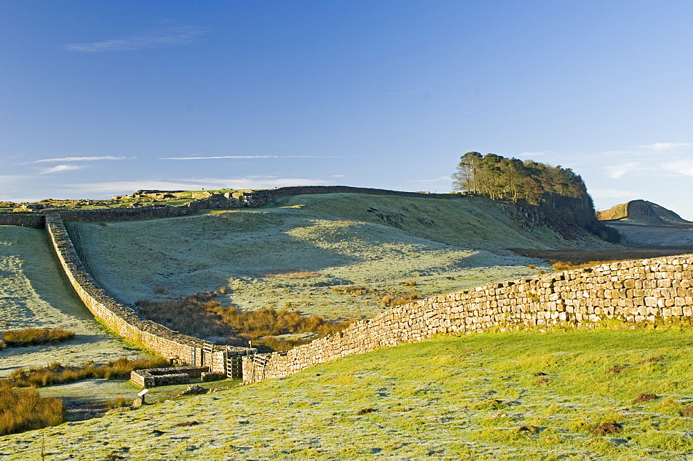 Hadrians Wall with civilian gate, a unique feature, and Housesteads Fort, Northumbria, England, United Kingdom, Europe