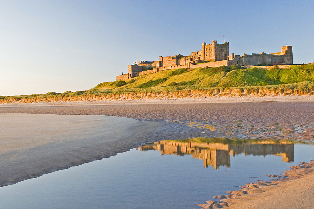 Morning light on the beach at Bamburgh Castle, Northumberland, England, United Kingdom, Europe