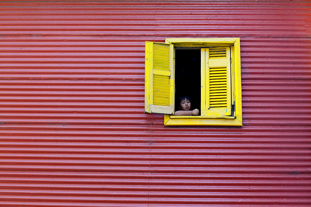 Child at a window, La Boca, Buenos Aires, Argentina, South America