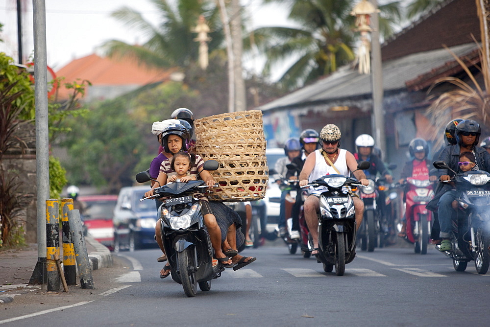 Motor cycles in traffic, Kuta, Bali, Indonesia, Southeast Asia, Asia