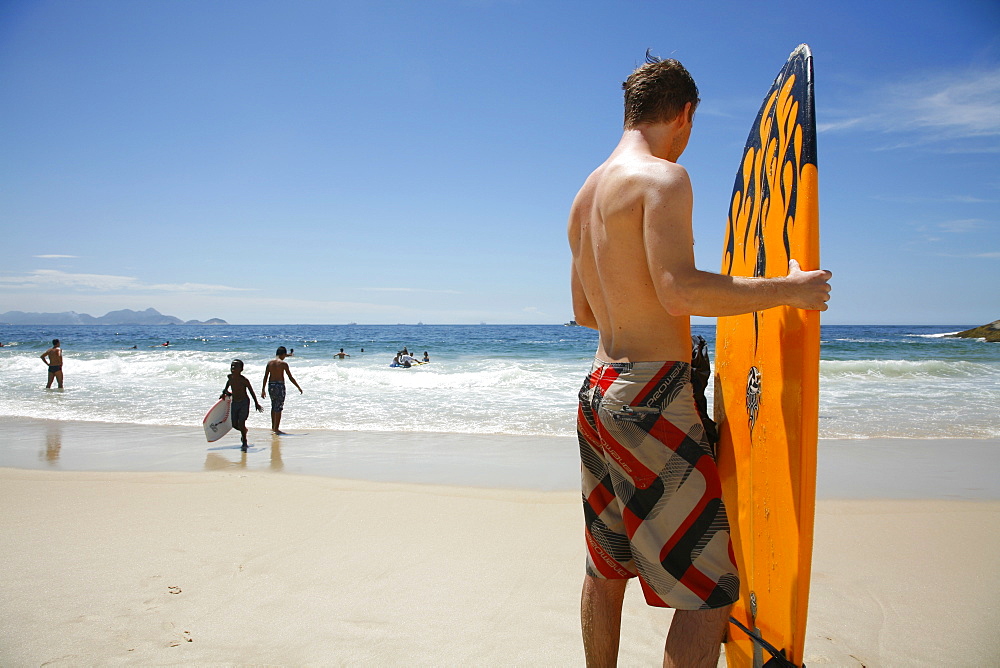 Surfer at Arpoador beach, Rio de Janeiro, Brazil, South America