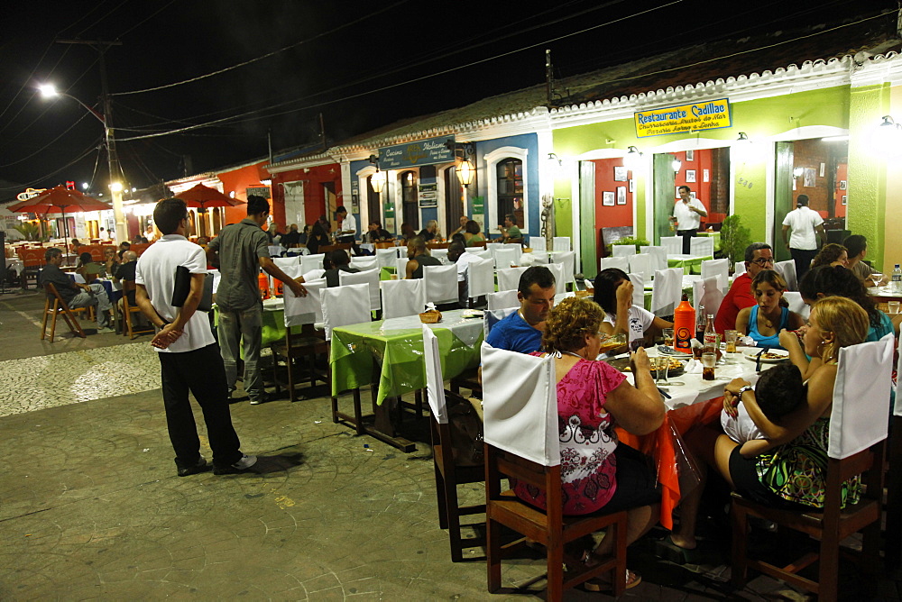 People sitting at outdoor restaurants in Porto Seguro, Bahia, Brazil, South America