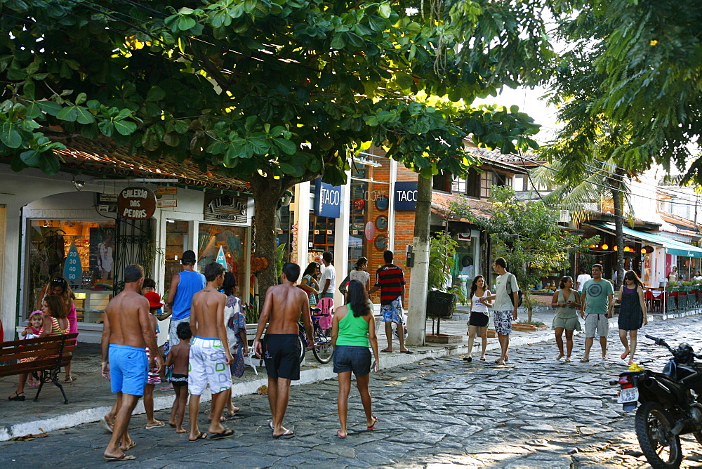 People walking on Rua das Pedras dotted with restaurants and boutiques, Buzios, Rio de Janeiro State, Brazil, South America