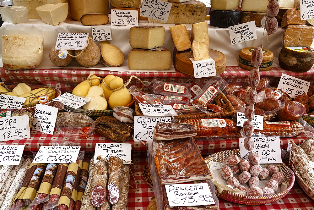 Cheese and salamis at Papiniano market, Milan, Lombardy, Italy, Europe