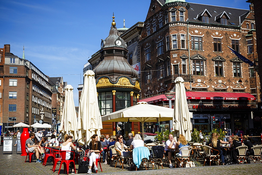 People sitting at a cafe in Nytorv, Copenhagen, Denmark, Scandinavia, Europe