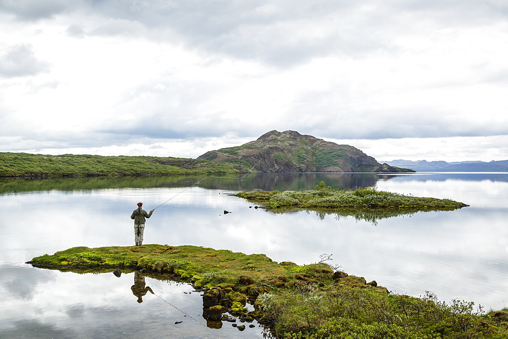 Man fishing at Thingvallavatn lake, Thingvellir (Pingvellir) National Park, UNESCO World Heritage Site, Golden Circle, Iceland, Polar Regions