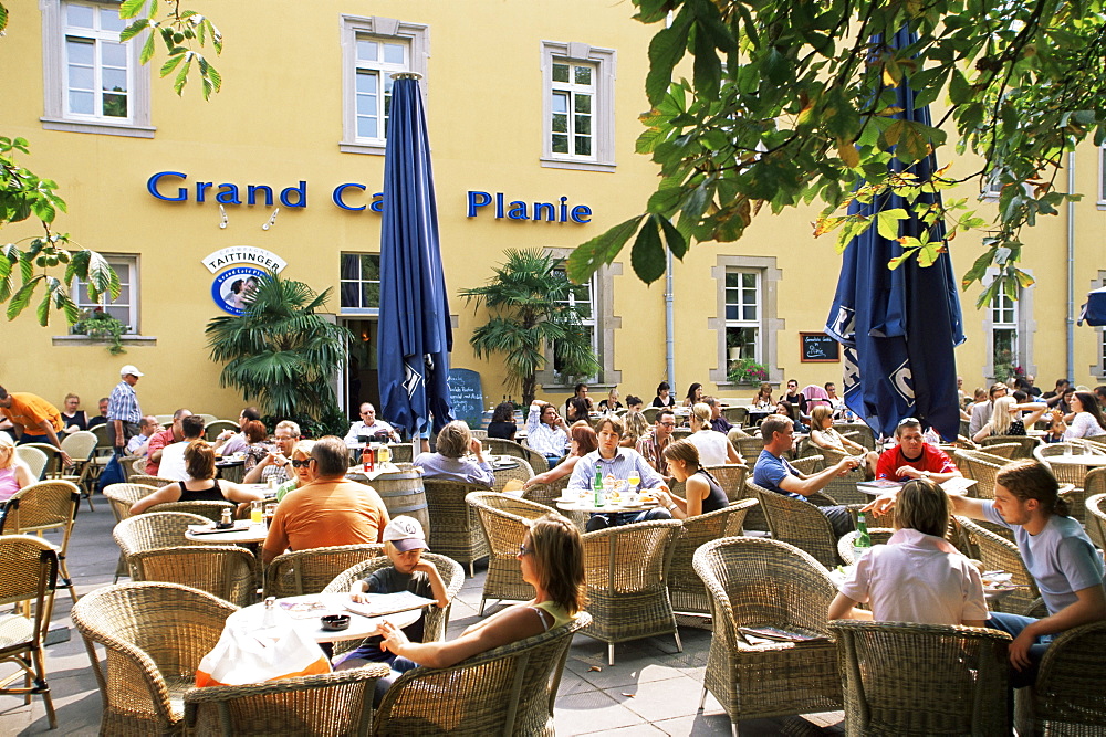 People sitting at an outdoor cafe on Karlsplatz, Stuttgart, Baden Wurttemberg, Germany, Europe