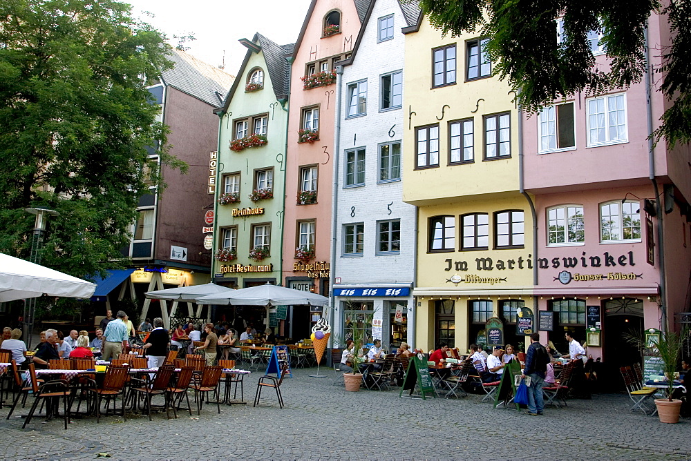 People sitting at outdoor restaurant in the old town, near the Fish Market, Cologne, North Rhine Westphalia, Germany, Europe