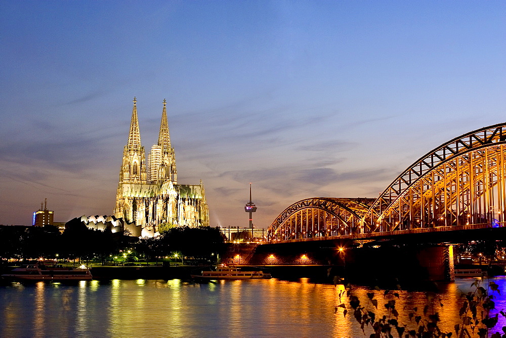 Cologne cathedral and Hohenzollern bridge at night, Cologne, North Rhine Westphalia, Germany, Europe