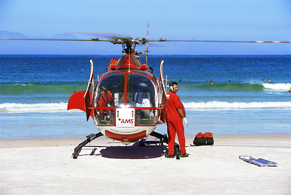 First aid medical helicopter lands on the beach, South Africa, Africa