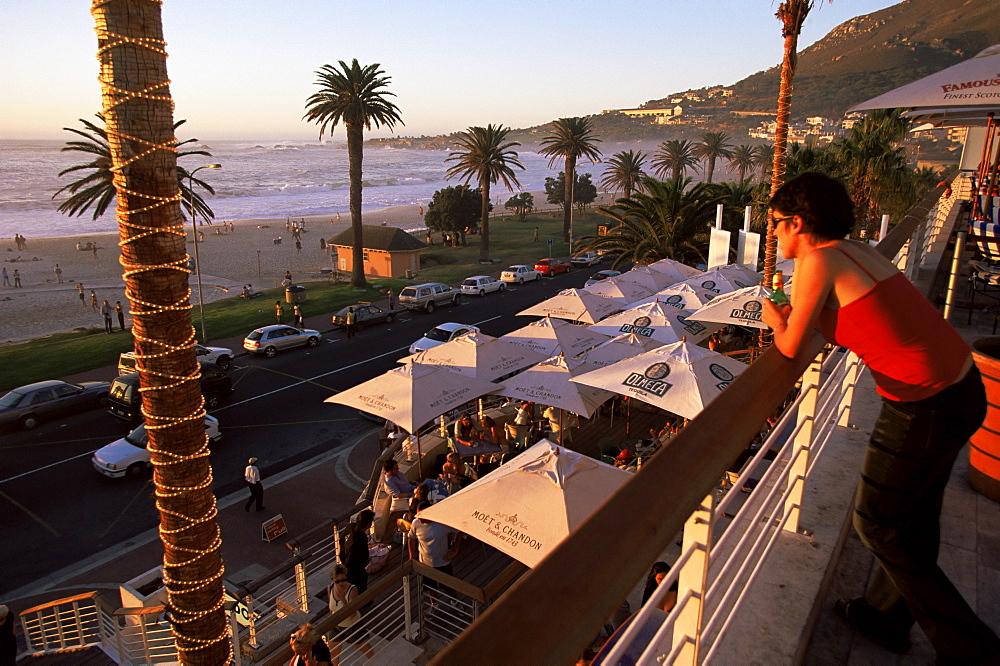 Young woman looking over Camps Bay, Cape Town, South Africa, Africa