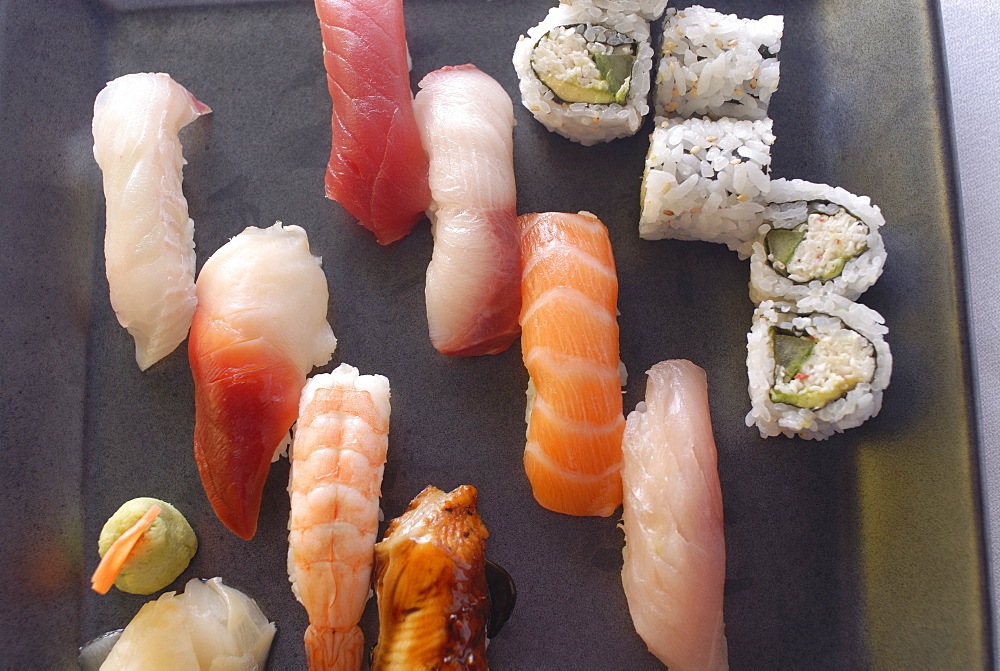 Plate of sushi covered with raw fish and stuffed, Japan, Asia