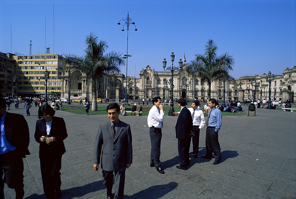 Business people talking on the Plaza de Armas, Lima, Peru, South America