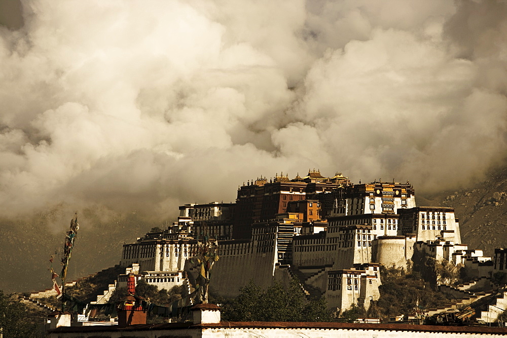 Image taken in 2006 and partially toned, dramatic clouds building behind the Potala Palace, UNESCO World Heritage Site, Lhasa, Tibet, China, Asia