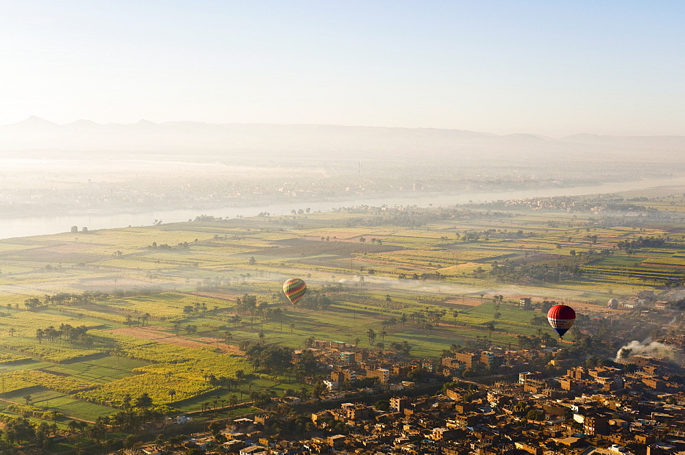 Hot air balloons over the West Bank (Western Thebes), Thebes, Egypt, North Africa, Africa