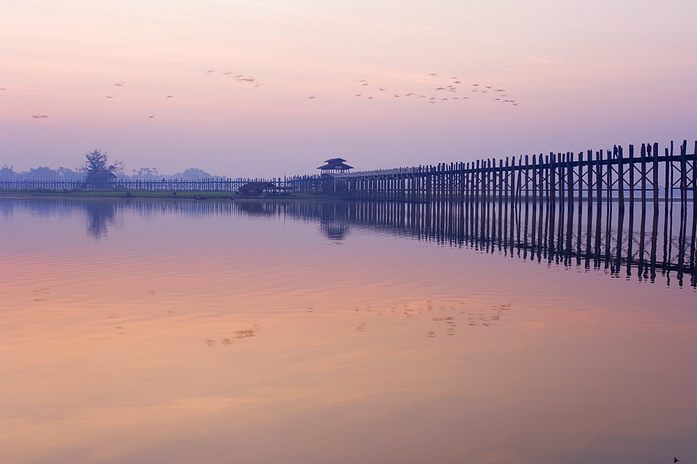 U Bein's Bridge across Thaungthaman Lake, at 1.2 km long the world's longest teak bridge, Amarapura, Myanmar (Burma), Asia