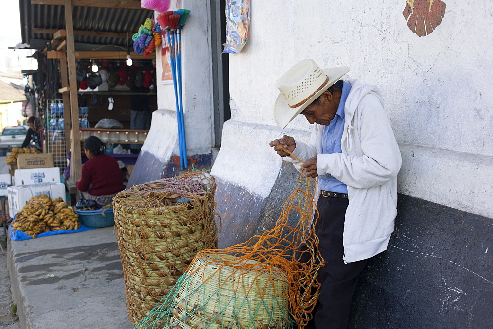 Man mending basket, Nebaj, Guatemala, Central America