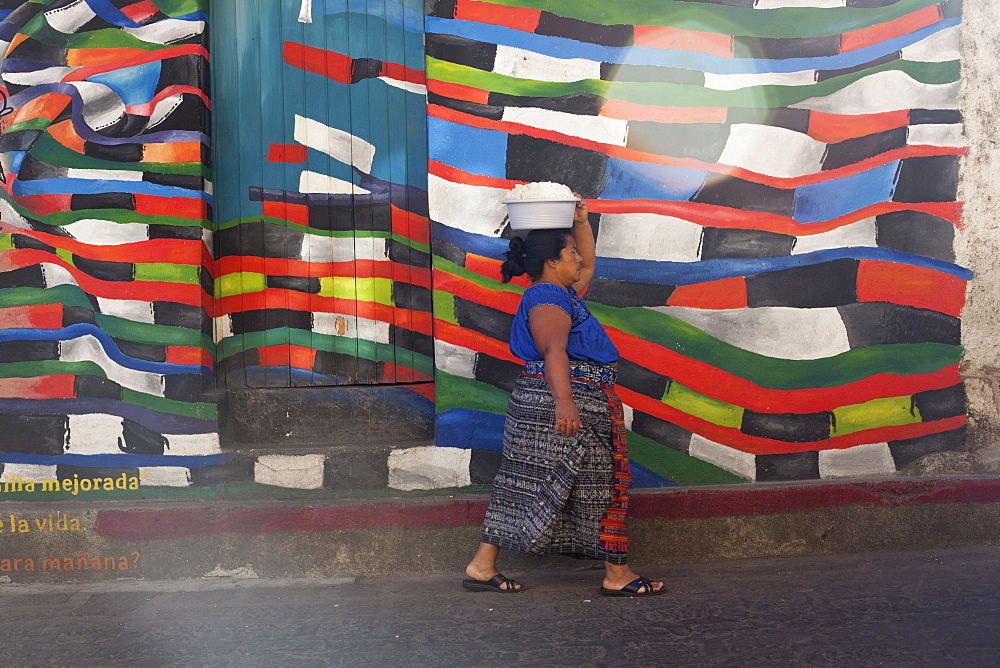 Mayan woman carrying a bowl of masa (corn tortilla dough), San Pedro, Guatemala, Central America