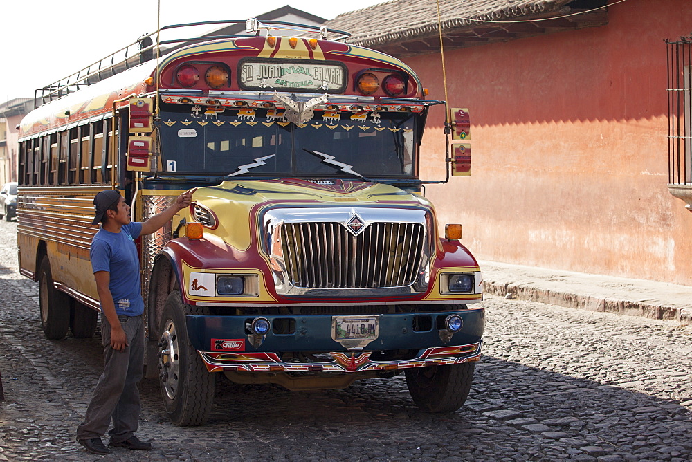 Chicken bus attendant calling for more passengers, Antigua, Guatemala, Central America