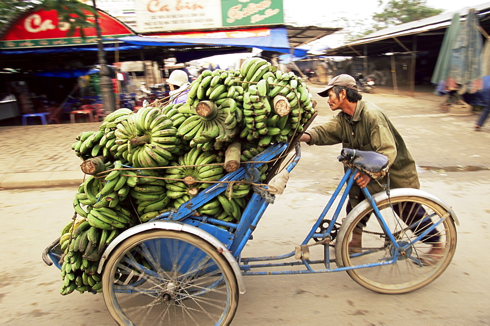 Man transporting bananas on cyclo, Hue, Vietnam, Indochina, Southeast Asia, Asia