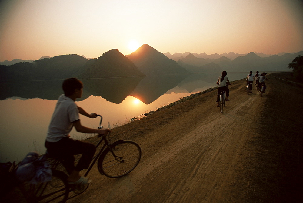 Cyclists, Cuc Phuong region, Vietnam, Indochina, Southeast Asia, Asia