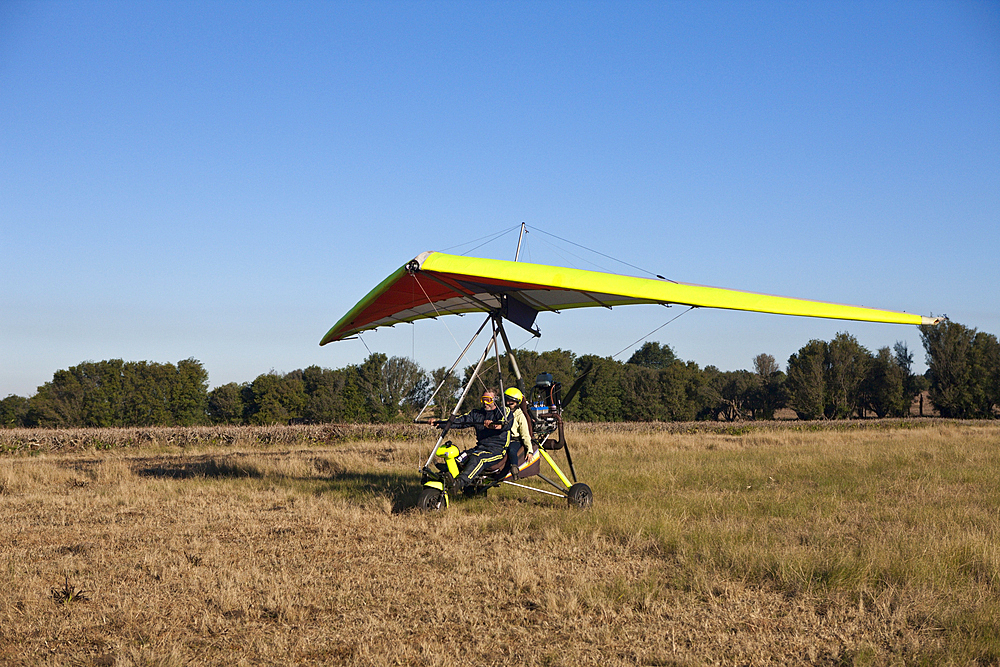 Tourists flying with ultralight trike, Mbotyi, Eastern Cap, South Africa