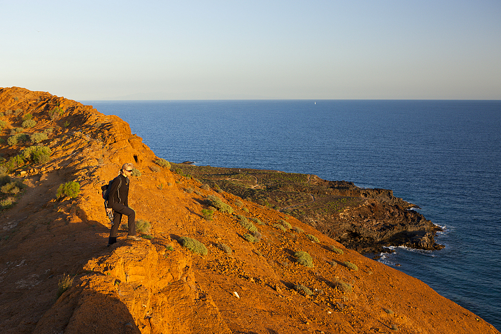 Tourist on Montana Amarilla near Costa del Silencio, Tenerife, Canary Islands, Spain