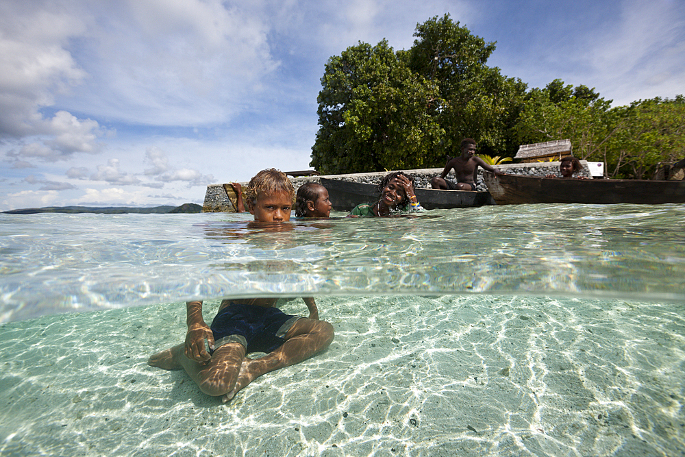 Children playing in Lagoon, Florida Islands, Solomon Islands