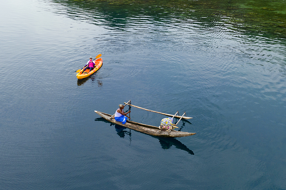 Women in Outrigger Canoe, Cape Nelson, Oro Province, Papua New Guinea