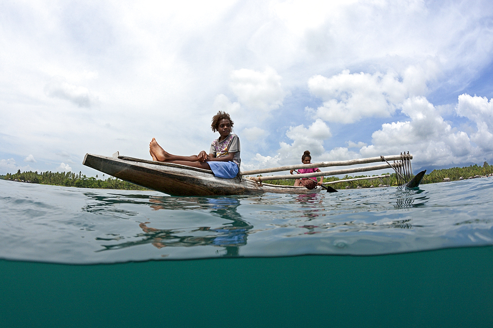 Women in Outrigger Canoe, Tufi, Cape Nelson, Papua New Guinea