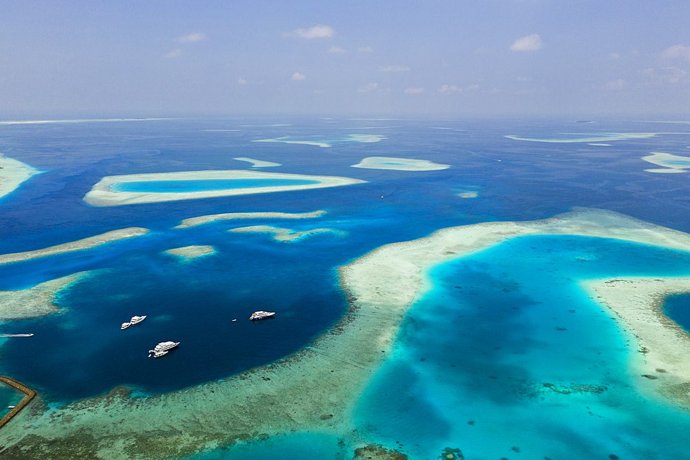 Liveaboards anchoring in Guraidhoo Lagoon, South Male Atoll, Indian Ocean, Maldives