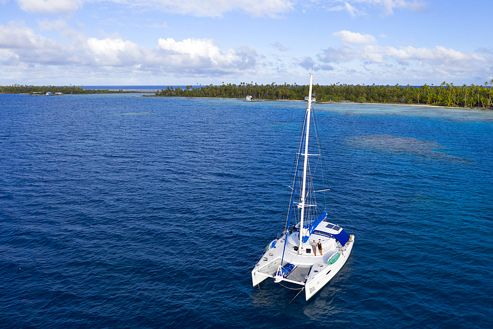 Catamaran at Ahe Atoll, Tuamotu Archipel, French Polynesia